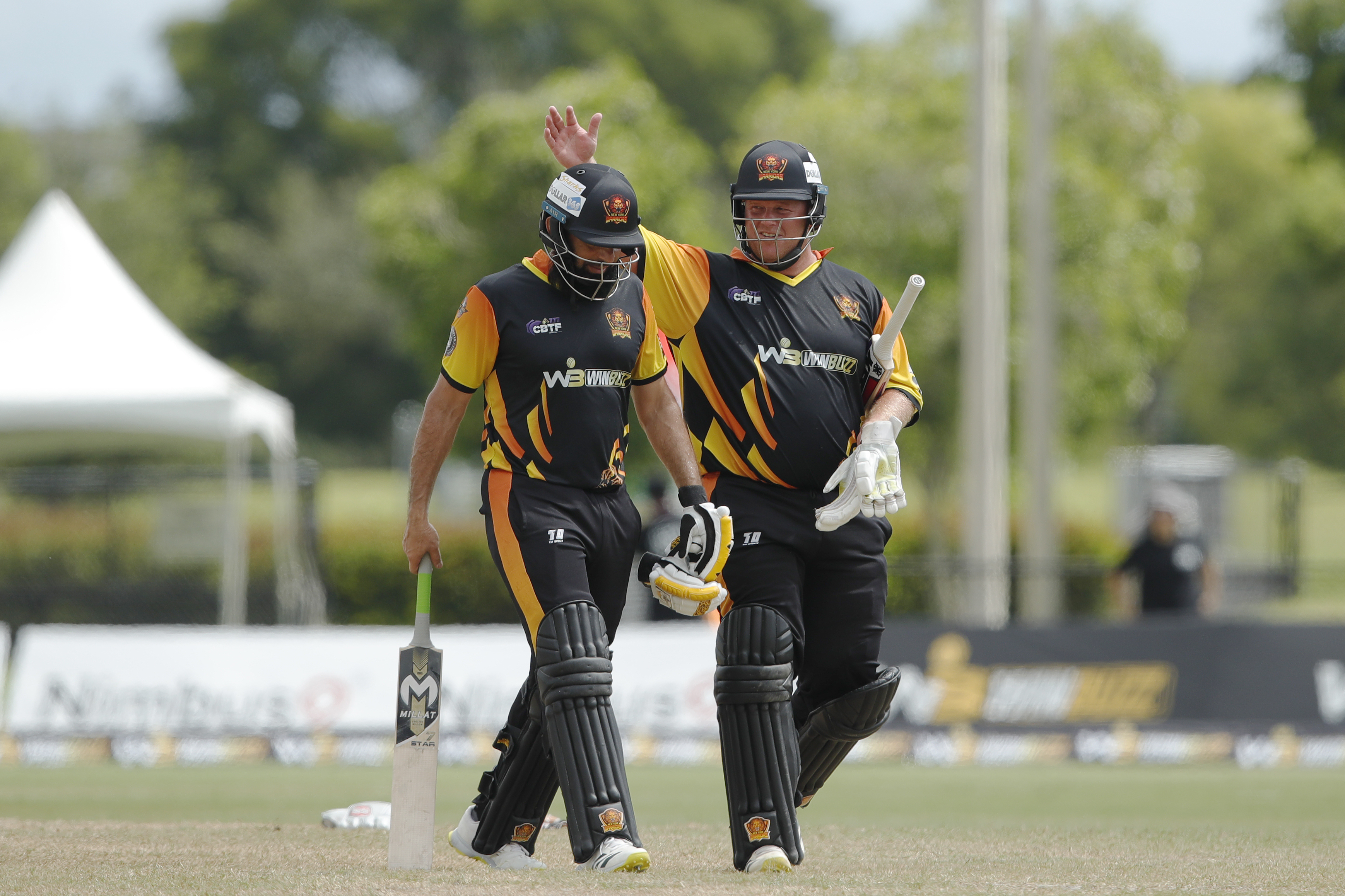 Misbah-ul-Haq (c) of New York Warriors and Richard Ernst Chad Levi of New York Warriors celebrating win during match 22, Qualifier 1 of the US Masters T10 League between the New York Warriors and the California Knights at the Central Broward Park in Lauderhill, Florida on the 26th August 2023 Photo by Saikat Das / ACEIMAGES for US Masters T10