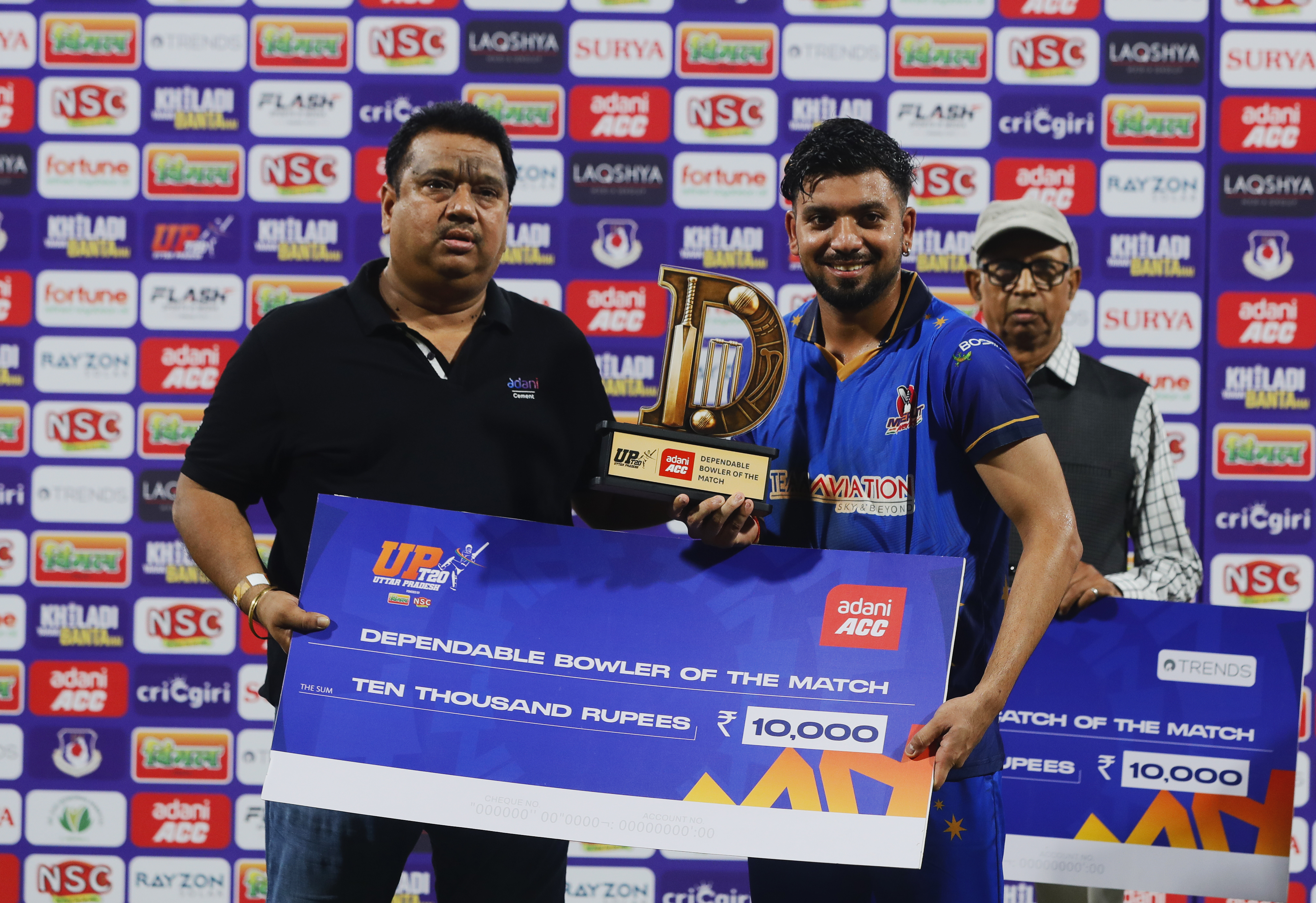 Yash Garg of Meerut Mavericks receiving Dependable Bowler of the Match award during the UPT20 League 2026 Season 4 opening clash between Kashi Rudras and defending champions Meerut Mavericks at Bharat Ratna Shri Atal Bihari Vajpayee Ekana Cricket Stadium, Lucknow, Uttar Pradesh, India, intense evening T20 action lights up Match 1 of the tournament.Photos by: s Saikat Das / aceimages.in for UPT20
