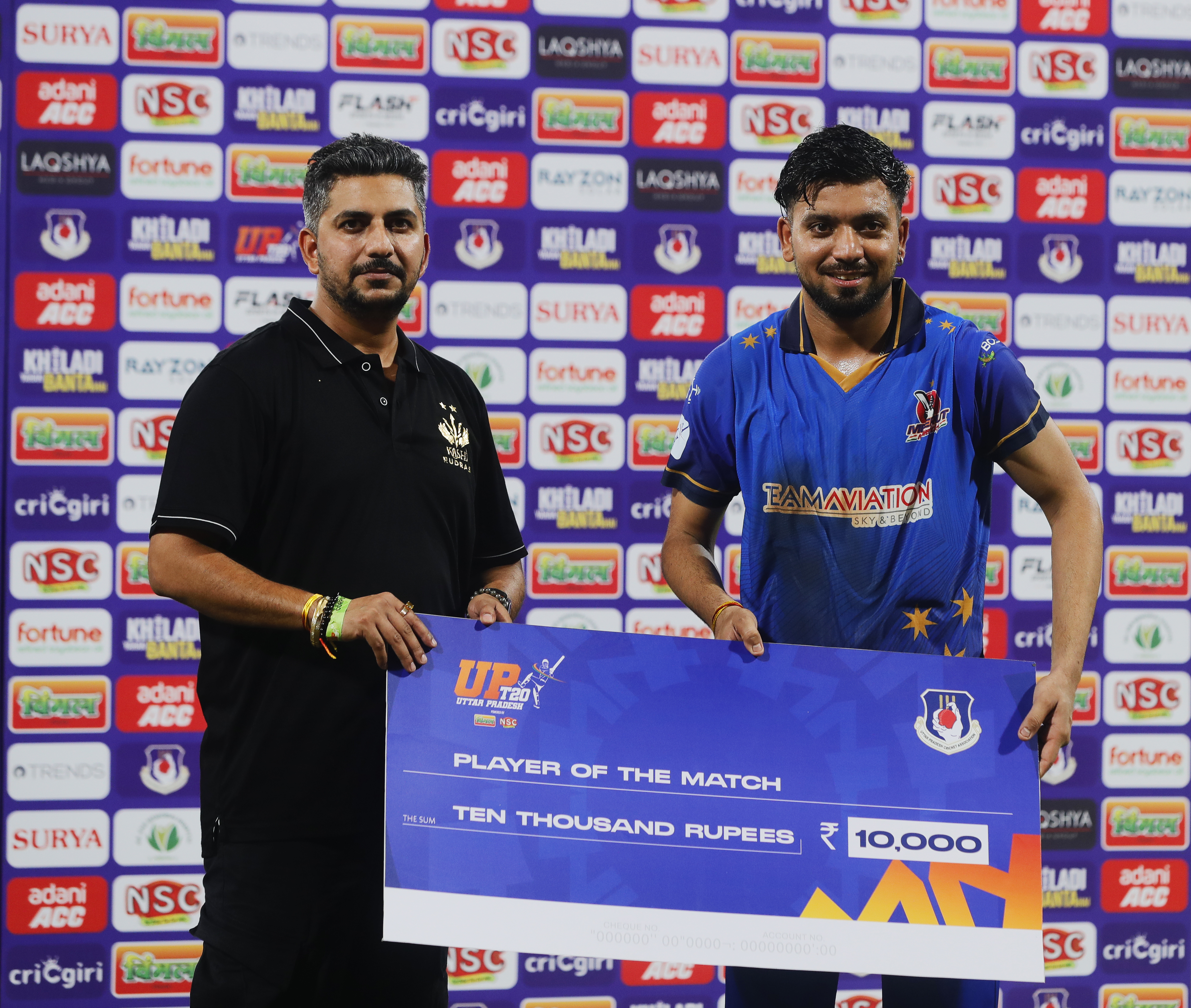 Yash Garg of Meerut Mavericks  receiving Player of The Match award during the UPT20 League 2026 Season 4 opening clash between Kashi Rudras and defending champions Meerut Mavericks at Bharat Ratna Shri Atal Bihari Vajpayee Ekana Cricket Stadium, Lucknow, Uttar Pradesh, India, intense evening T20 action lights up Match 1 of the tournament.Photos by: s Saikat Das / aceimages.in for UPT20