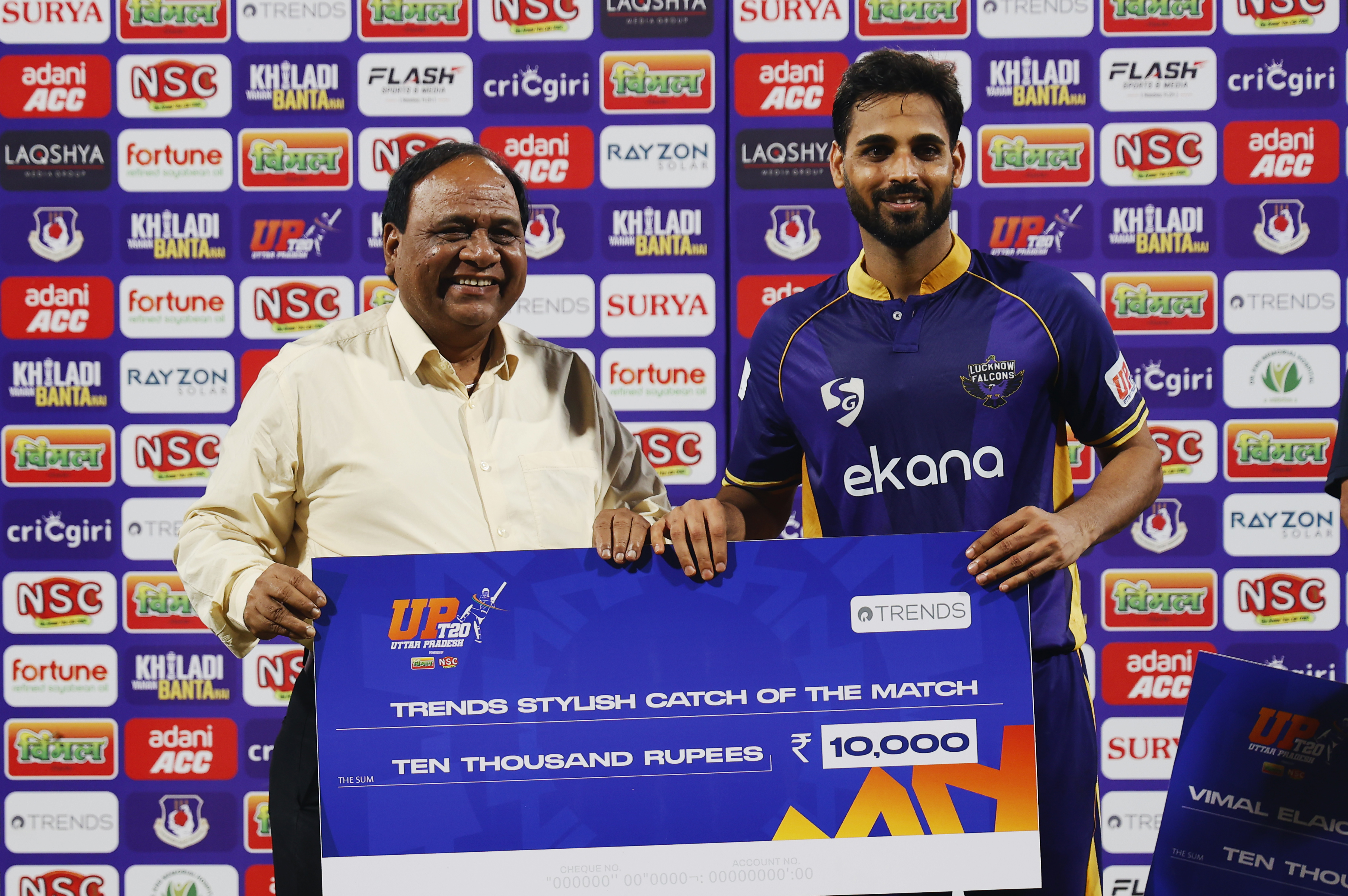 Bhuvneshwar Kumar (c) of Lucknow Falcons receiving Trends Stylish Catch of the Match award during the UPT20 League Season 4 evening clash on 15 August 2026 at Bharat Ratna Shri Atal Bihari Vajpayee Ekana Cricket Stadium, Lucknow, Uttar Pradesh, India, Lucknow Falcons face Gaur Gorakhpur Lions in Match 3 under lights as the league’s double‑header day closes with high‑tempo T20 cricket.Photos by: s Saikat Das / aceimages.in for UPT20