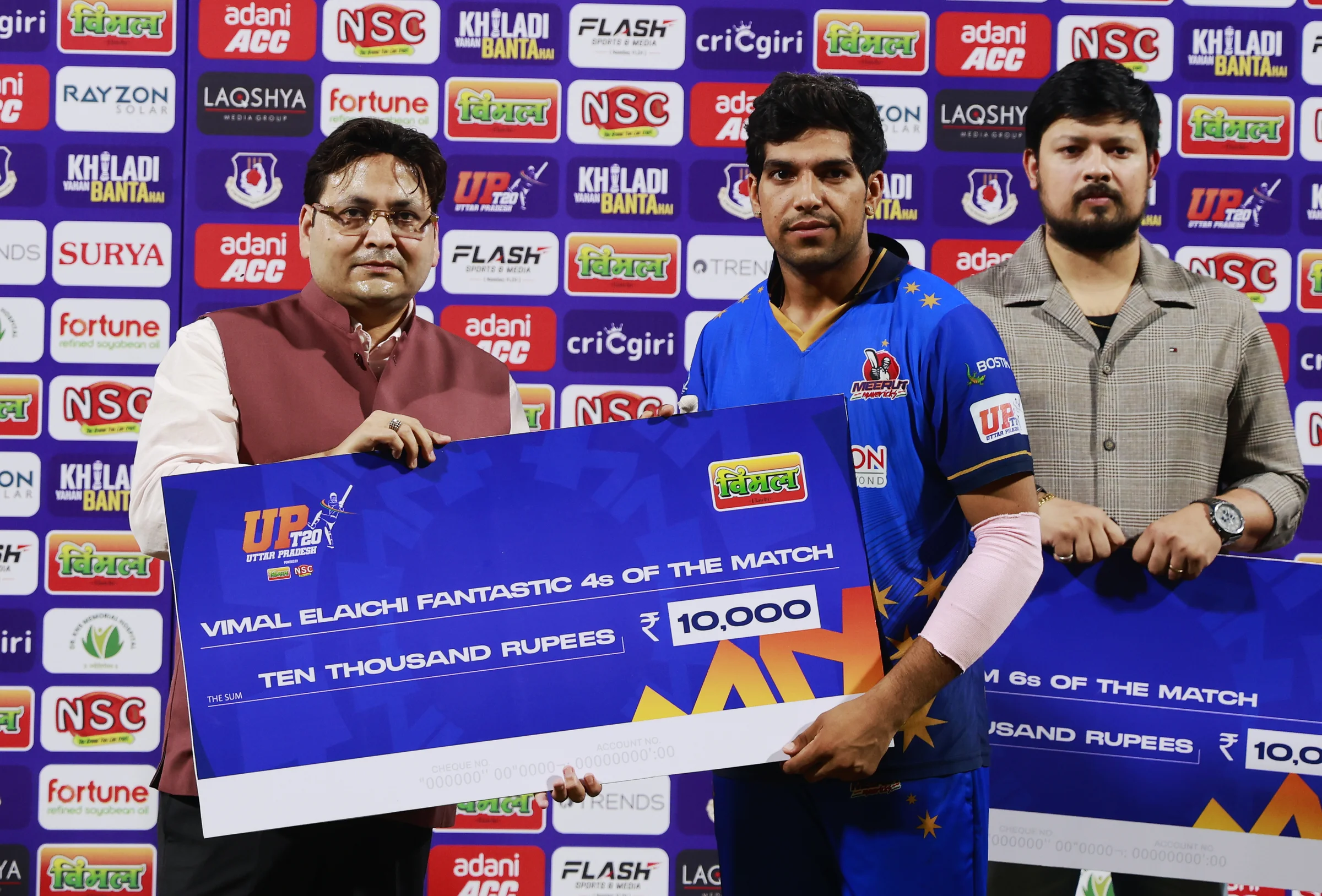 Swastik Chikara of Meerut Mavericks receiving Vimal Elaichi Fantastic 4s of the Match award during the UPT20 League Season 4 night clash on 16 August 2026 at Bharat Ratna Shri Atal Bihari Vajpayee Ekana Cricket Stadium, Lucknow, Uttar Pradesh, India, Gaur Gorakhpur Lions take on defending champions Meerut Mavericks in Match 5 under lights as Purvanchal’s pride meets Meerut’s grit in a high‑intensity T20 battle.Photos by: s Saikat Das / aceimages.in for UPT20